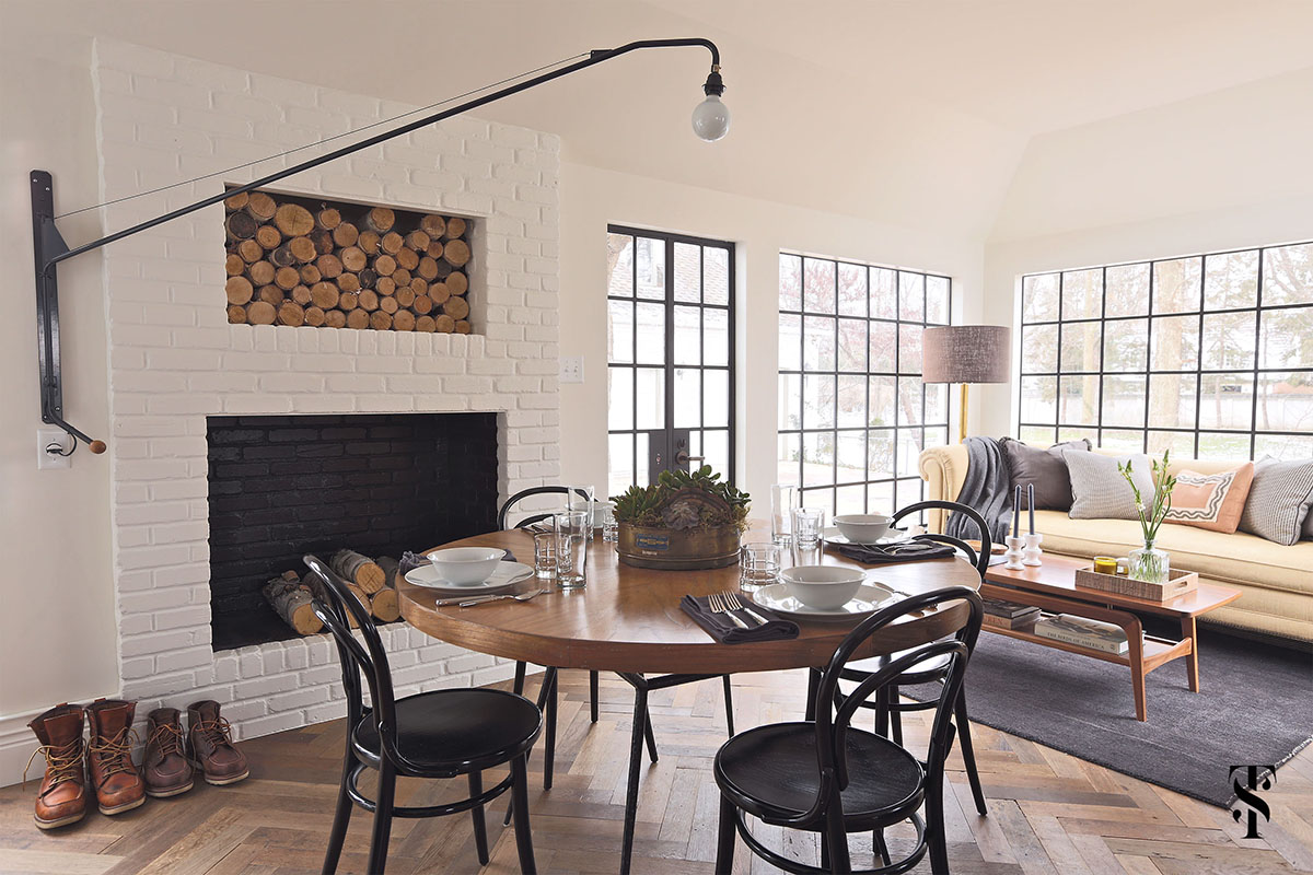Country Club Tudor, Dining Table In Front Of Fireplace With Built-In Log Holder, Steel Frame Windows, Interior Design By Summer Thornton Design