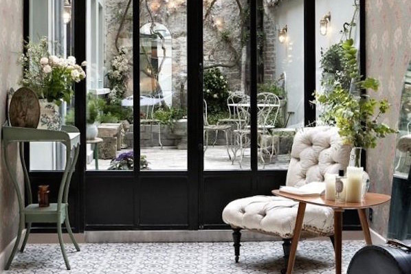Parisian Interior sunroom with steel doors and steel windows in a sun room or greenhouse