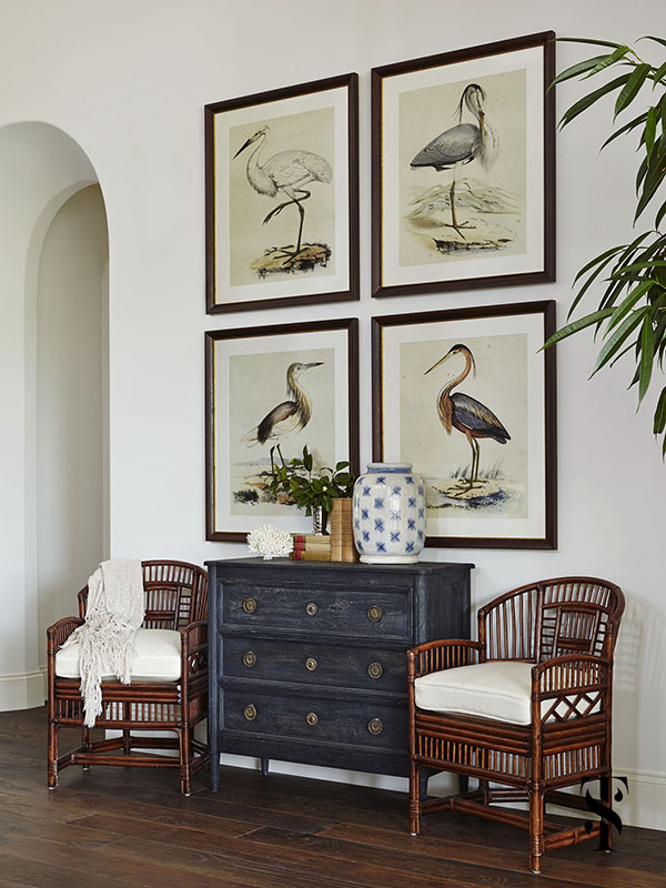 Naples Interior Design - interior designer Summer Thornton - audubon bird print artwork in a great room with cane chairs - www.summerthorntondesign.com
