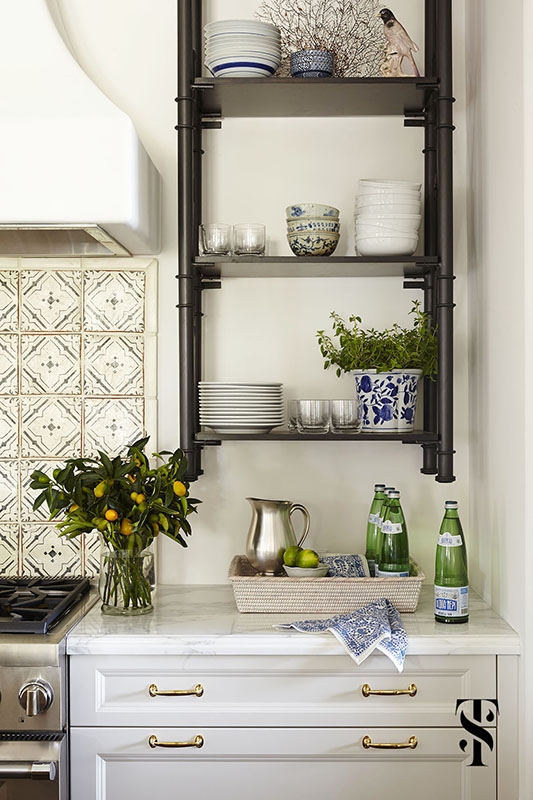 Naples Florida Kitchen Designer Summer Thornton - kitchen with wall mounted sleves, plaster hood and chinese pottery styled with kumquat branches and green bottles - www.summerthorntondesign.com