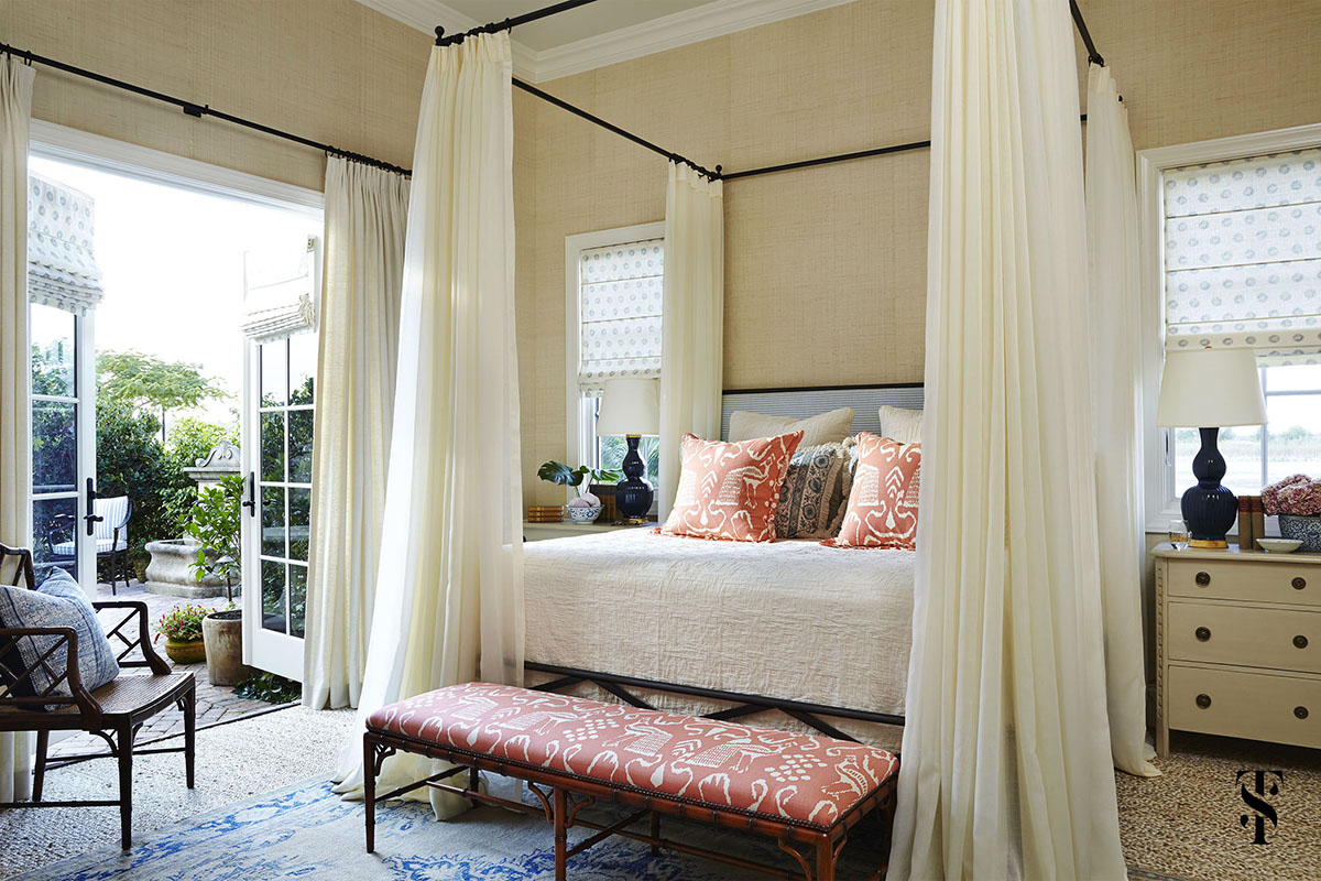 Naples Interior Designer Summer Thornton | bedroom with cream grasscloth walls and four poster bed opening to garden | www.summerthorntondesign.com