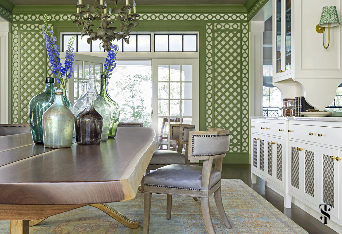 wisconsin lake house dining room in green trellis with live edge dining table, interior design by summer thornton www.summerthorntondesign.com