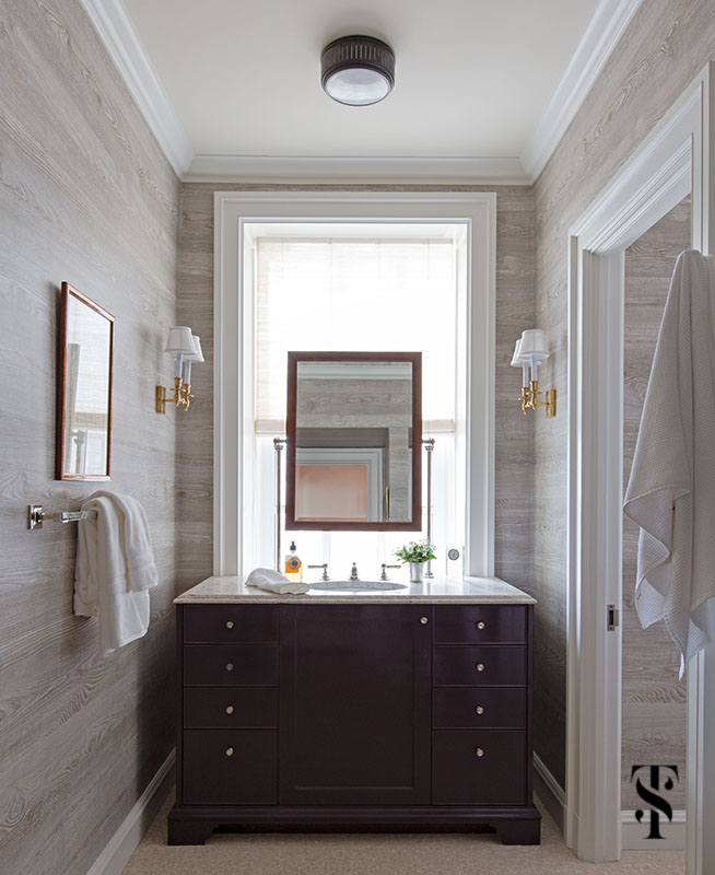 Interior design by Summer Thornton of a Chicago Co-Op at 1500 Lake Shore Drive. Bathroom features a faux bois wallpaper and masculine touches.