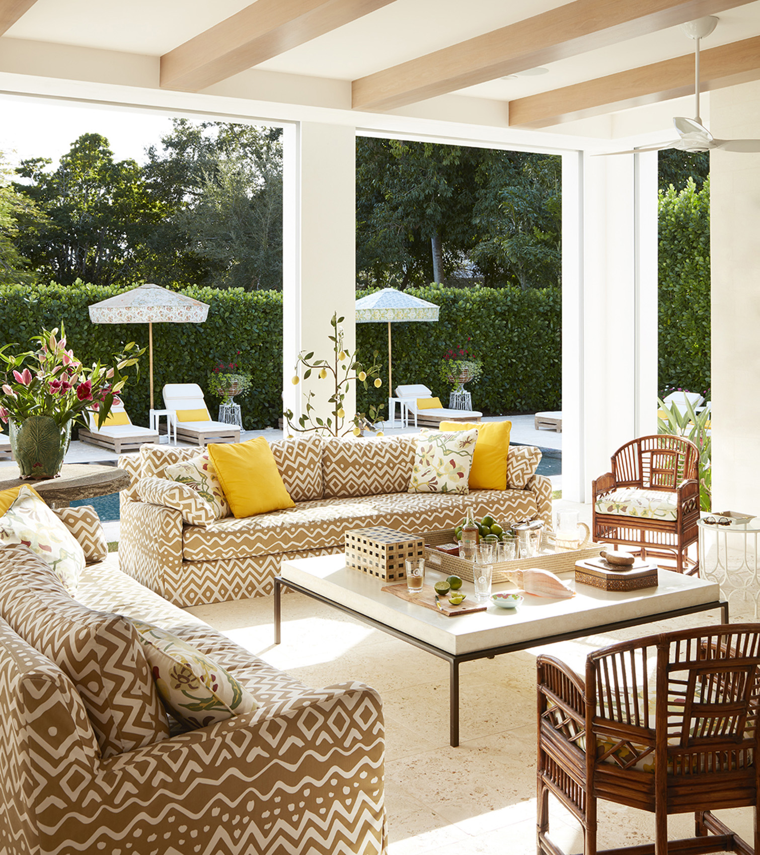 Interior design by Summer Thornton for this tropical lanai located in Old Naples, FL with colorful details