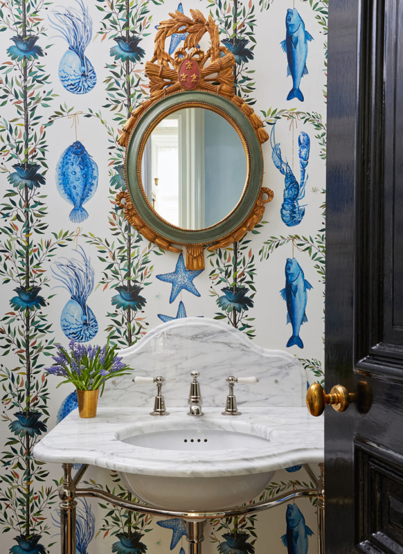 Summer Thornton’s personal Chicago residence designed by Summer Thornton. Powder Bath features Pierre Frey acqautic wall coverings, polished nickel pedestal sink and a Louis XVI Style Carver's Guild Giltwood Mirror.