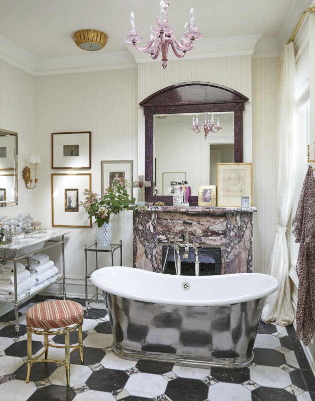 Summer Thornton’s personal Chicago residence designed by Summer Thornton. Master Bathroom features a nickel tub, graphic floors and a marble fireplace.