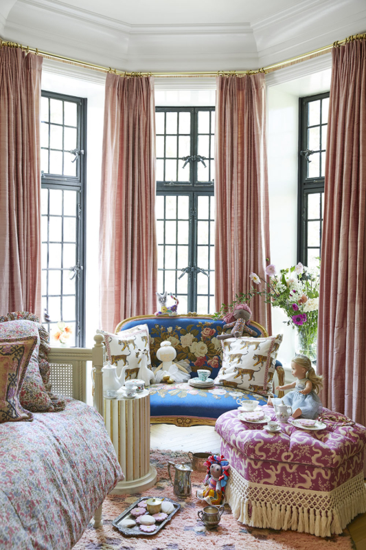 Summer Thornton’s personal Chicago residence designed by Summer Thornton. Girls Bedroom features a 17th century French needlepoint settee from the Paris flea market and pink floor-to-ceiling drapery.