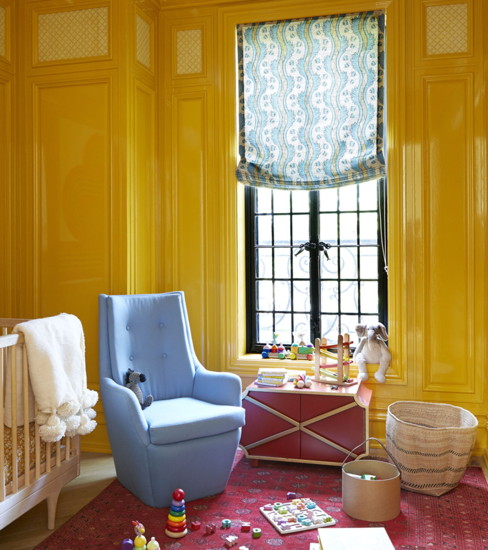 Summer Thornton’s personal Chicago residence designed by Summer Thornton. This little gentleman’s bedroom features Russian red carpet, glossy yellow wall panelling, William Morris textiles and Fornasetti clouds.
